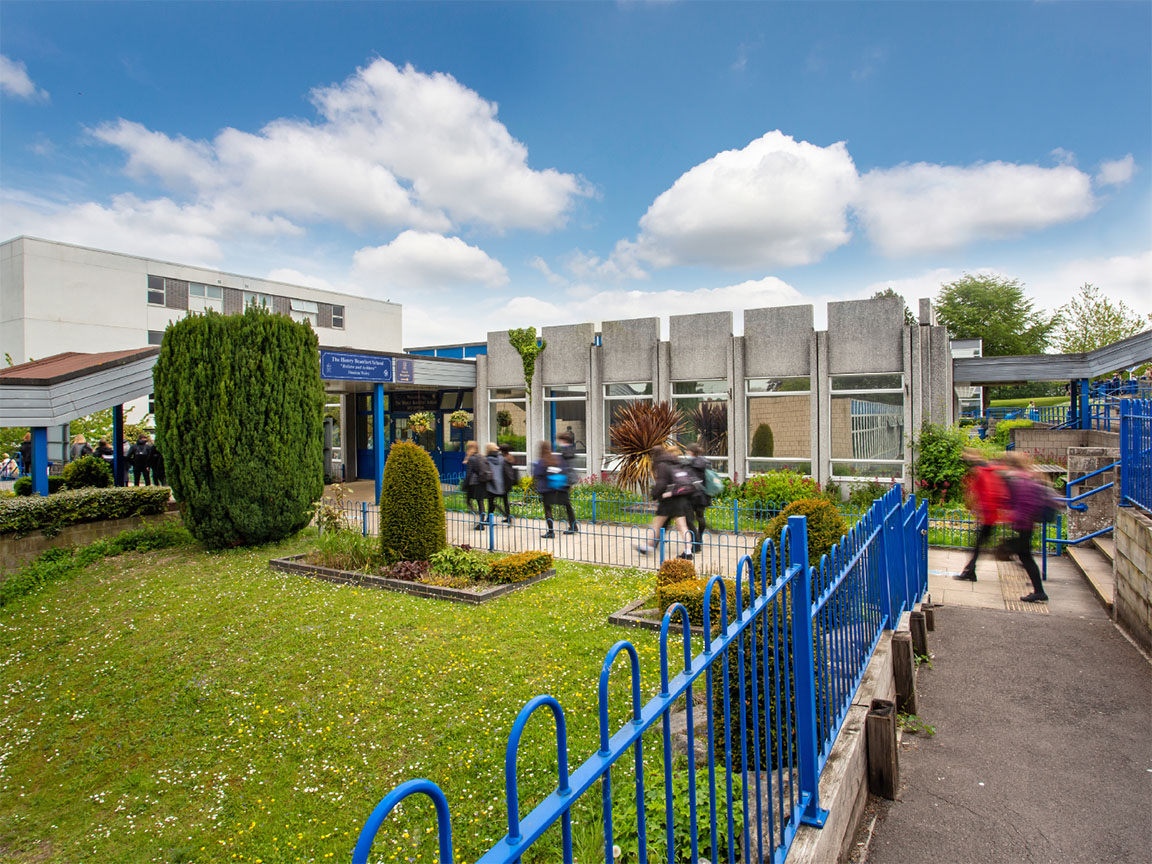 Students making their way towards the entrance of the school.