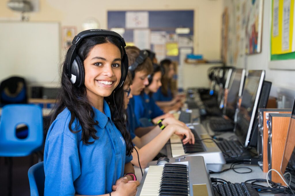 Happy student in music class