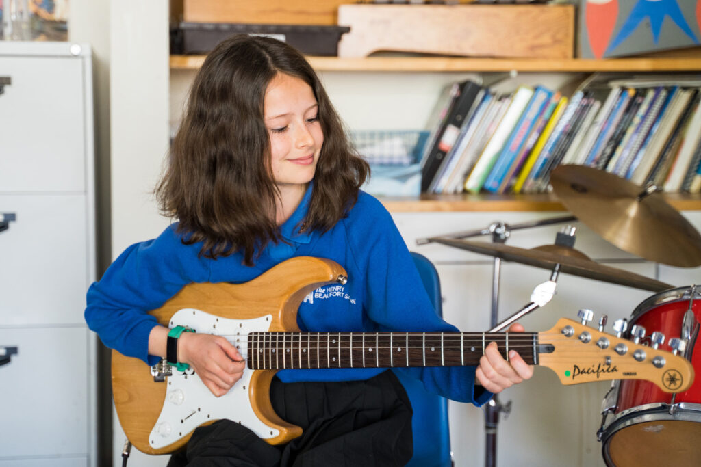 Girl playing guitar music